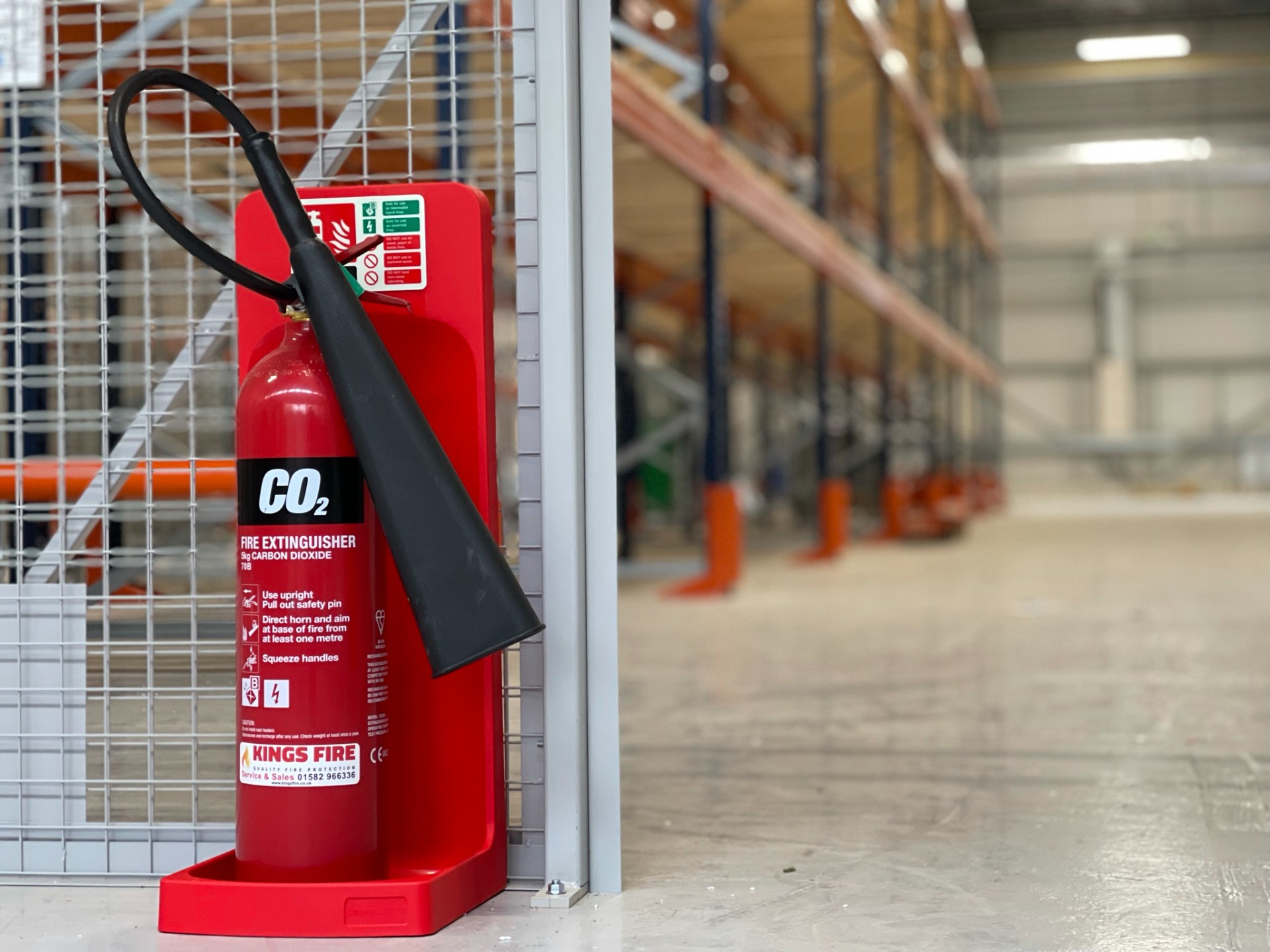 5kg CO2 Extinguishers installed onto a single extinguisher stand in a new warehouse